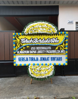 Papan Bunga Duka di Paminggir